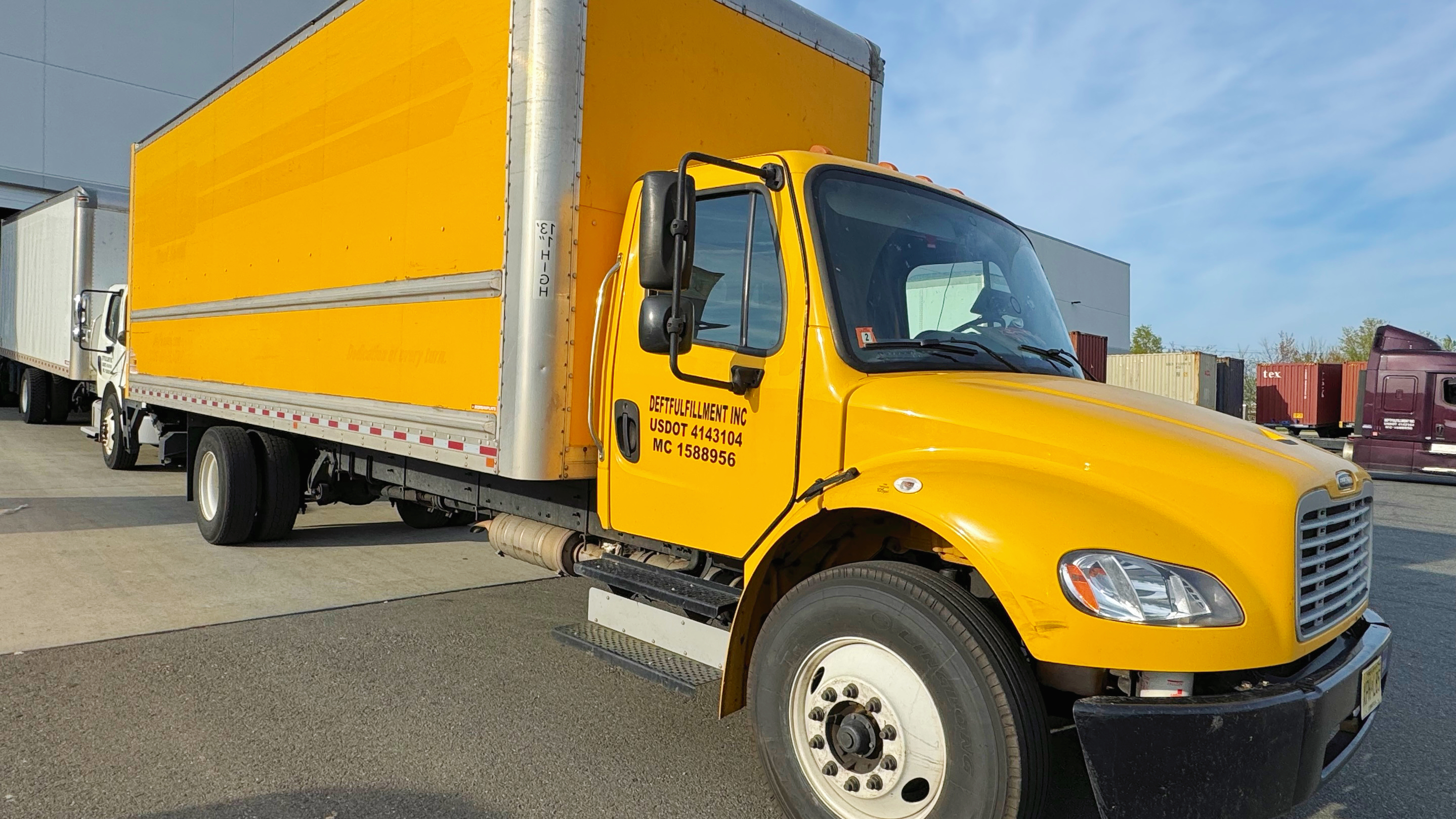 Deftfulfillment box truck loading freight at the yard